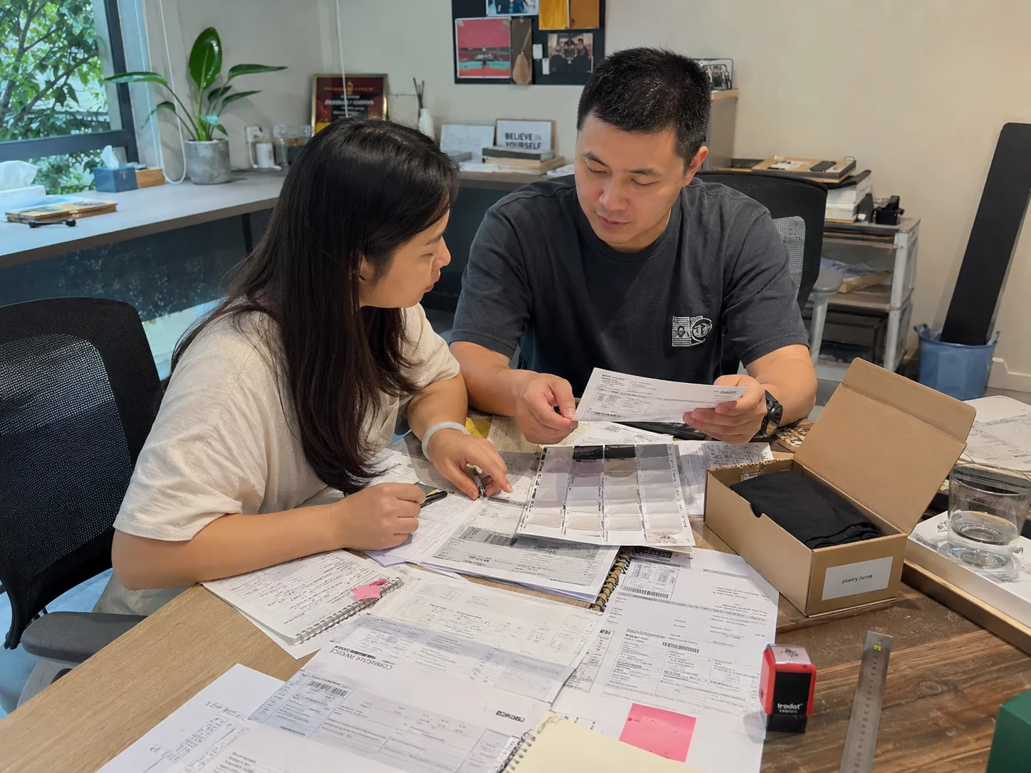 Warehouse team organizing cartons from multiple suppliers